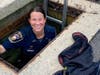 Bethel Officer Ditullio swapped out her uniform boots for rubber waders and took the plunge to rescue a kitten trapped between two storm drains,