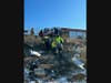 Crews established a system of ropes to safely access the wreckage, free the driver from the cab of the truck, and haul him back up the hill to the roadway. 
