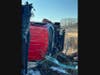 Crews established a system of ropes to safely access the wreckage, free the driver from the cab of the truck, and haul him back up the hill to the roadway. 