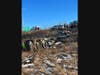 Crews established a system of ropes to safely access the wreckage, free the driver from the cab of the truck, and haul him back up the hill to the roadway. 