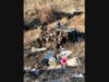 Crews established a system of ropes to safely access the wreckage, free the driver from the cab of the truck, and haul him back up the hill to the roadway. 