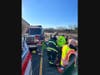 Crews established a system of ropes to safely access the wreckage, free the driver from the cab of the truck, and haul him back up the hill to the roadway. 