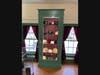 For his scouting capstone, Kyle Stejskal designed and built four 7-foot lit cabinets to house the art that was spilling out of storage crates and onto the floor of the Bethel Historical Society.
