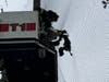 Firefighters extended the ladder from one of their trucks up to where a goose had become entangled in the netting.