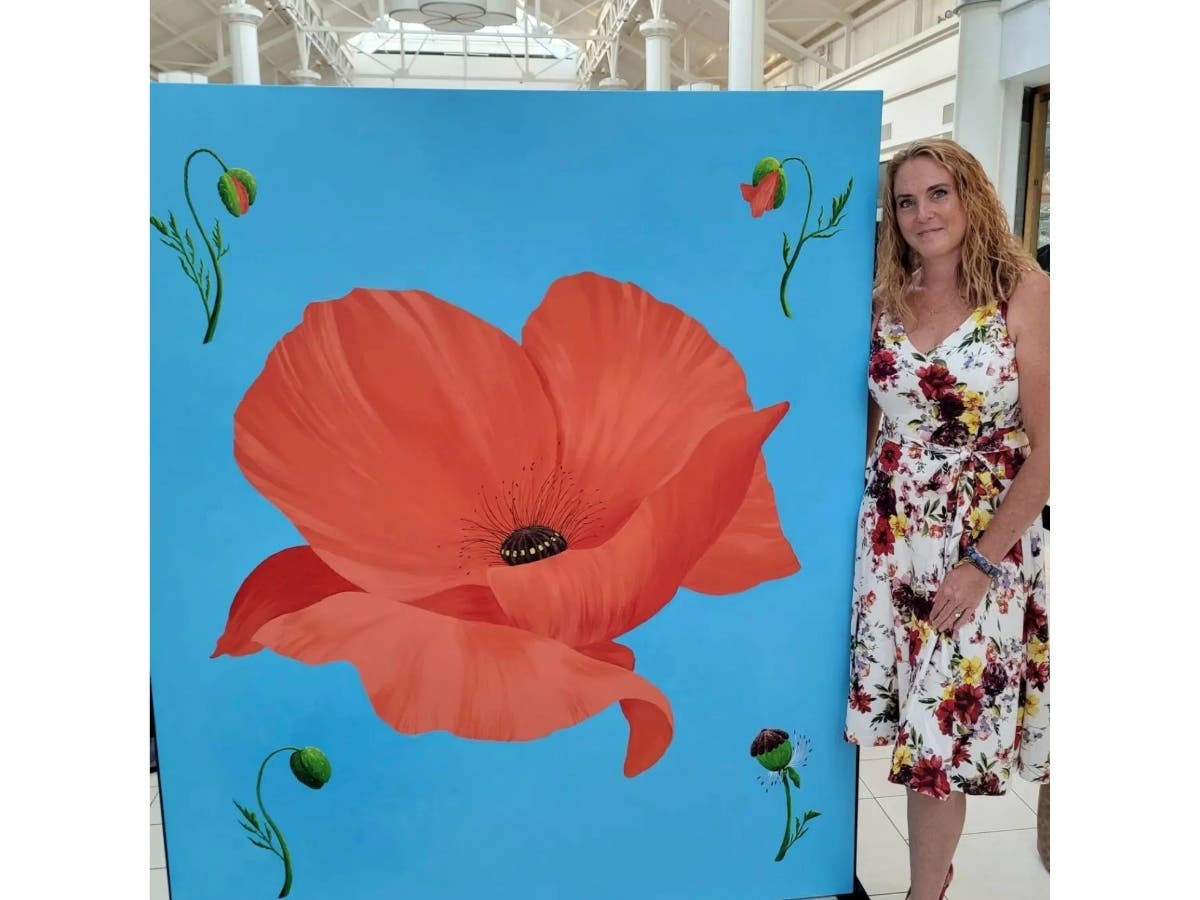 Janelle Chandler reveals her Moving Mural panel at Danbury Fair mall. The panel is part of a special project to “inspire balance, hope and connection.”