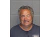 Philip Caseria, 60, of West Knollwood Terrace, can be seen on surveillance video pointing a handgun at the front door of 574 Wines, 574 Monroe Turnpike on Saturday afternoon. 