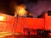 First responders from the Danbury Fire Department found heavy fire conditions in the rear of a two-and-a-half story residential building