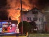 First responders from the Danbury Fire Department found heavy fire conditions in the rear of a two-and-a-half story residential building