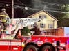 First responders from the Danbury Fire Department found heavy fire conditions in the rear of a two-and-a-half story residential building