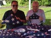 Reps. Bolinsky and Foncello with flags donated for proper retirement