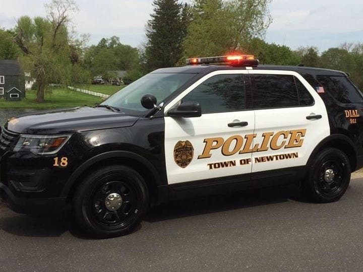 The suspect, Meghan Gouveia, 32, of Newtown, has been charged with first-degree assault, among other firearms offenses.