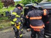 After hitting the pole, the SUV rolled over, trapping the driver, according to the Danbury Fire Department.