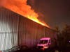 First responders found a working fire inside the warehouse at 36 Kenosia Avenue in Danbury, and quickly upgraded the response to a fourth alarm