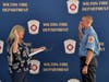 Wilton Firefighter Timothy LeStrange being sworn in by Assistant Town Clerk MaryEllen Demers