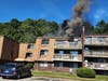 First responders reported heavy smoke​ pouring from a third floor balcony slider and numerous people trying to evacuate. 