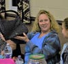 Beverly DeSimone of Southampton, PA shows off the Coach Bag she won at the Bucks County Children’s Advocacy Center’s seventh annual Coach for a Cause Bingo Event held at St. Anne’s Ukrainian Church Bingo Hall in Warrington, Pa.