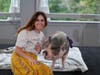 Jennalynn Whitley, Director, All Saints Day School, and a pot-bellied pig named Raines, were all smiles at TruMark Financial’s Kiss-Or-Feed-A-Pig Financial Literacy Fundraiser . All Saints Day School will receive a grant from the proceeds of the event. 