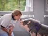 Patricia Torpey, representing Our Lady of Calvary, shows some love to a pot-bellied pig named Raines at TruMark Financial’s Kiss-Or-Feed-A-Pig Financial Literacy Fundraiser. Our Lady of Calvary will receive a grant from the proceeds of the event. 