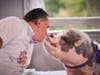 Phil Carr, Dean, Baldi Middle School, showed rare form as he kissed a pot-bellied pig named Raines at TruMark Financial’s Kiss-Or-Feed-A-Pig Financial Literacy Fundraiser. Baldi Middle School will receive a grant from the proceeds of the event. 