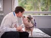 Stephen Hewitt, Dean of Students, Maritime Academy Charter School, was all-in to feed and kiss a pot-bellied pig named Raines at TruMark Financial’s Kiss-Or-Feed-A-Pig Financial Literacy Fundraiser held at the Abington Art Center. 