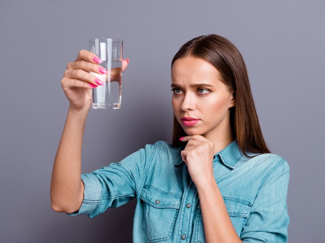 Close up portrait of not sure in quality of water she her woman
