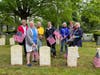 Hannah Benedict Chapter of The Daughters of the American Revolution placing flags at Lakeview Cemetery