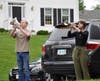 West Springfied High school students Troy Burke and Alexandra Kowalski rehearse echo Taps before dispersing to locals within the neighborhood.