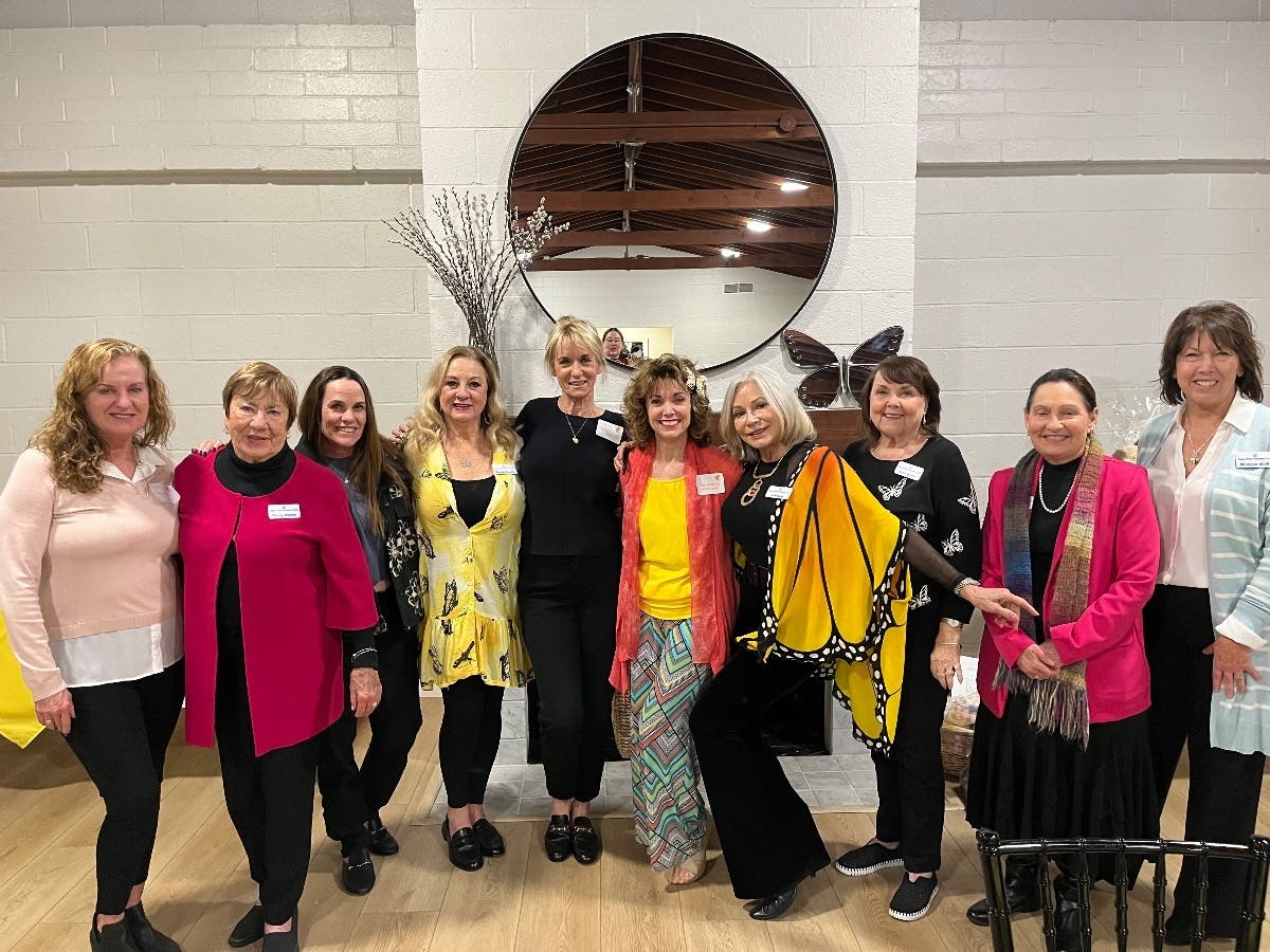 DPWC members pose with Butterfly speaker, Susie Vanderlip, CSP, CPAE (center in yellow top) at its March 7th general meeting.