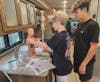 Students explore a human anatomy model during a recent visit from the Mobile Access to Possibilities (MAPs) vehicle. 