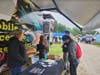 At left, Nicole Levesque and Deputy Commissioner Christine Brennan of the New Hampshire Department of Education assist with the Mobile Access to Possibilities vehicle during NH Construction Career Days in New Boston. 