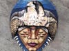 “Falcon Animal Totem” by Carlos Mateu (acrylic on horseshoe crab shell)