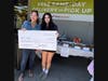 PALY junior Maya Bhalla and Palo Alto Mayor Vicki Veenker celebrate the more than $3,000 Maya raised through seven bake sales to benefit Doggie Protective Services Rescue, which cares for dogs and cats awaiting adoption.