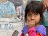 A little girl grateful for the gifts provided by Operation Feed. 