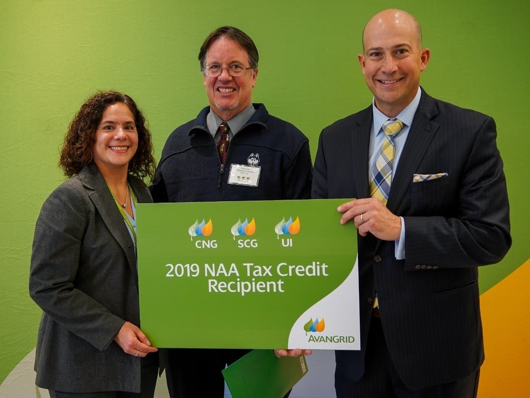 From left to right, Eileen Lopez-Cordone from UIL Holdings, Chris Carroll, Development Director at Sterling House, and, Al Carbone, Manager of Government and Community Relations for AVANGRID, at a recent NAA check presentation gathering in North Haven.