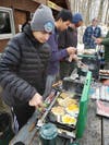 John Martoccia, Jack Guan and Cameron Lutz cook breakfast
