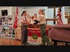 Life Scout, Phil La Belle receives his merit badges from Scoutmaster, Jeff Lutz.