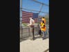 Troop 200 Scouts Owen Maslanka and Gavin Martorana remove a worn flag with the help of Steve Martorana