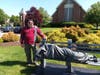 Rev. Dr. David Buegler, Pastor Emeritus at St. Paul Westlake, stands alongside the sculpture "Homeless Jesus."