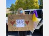 Middle school science teacher Patty Borell showing support during the parade.