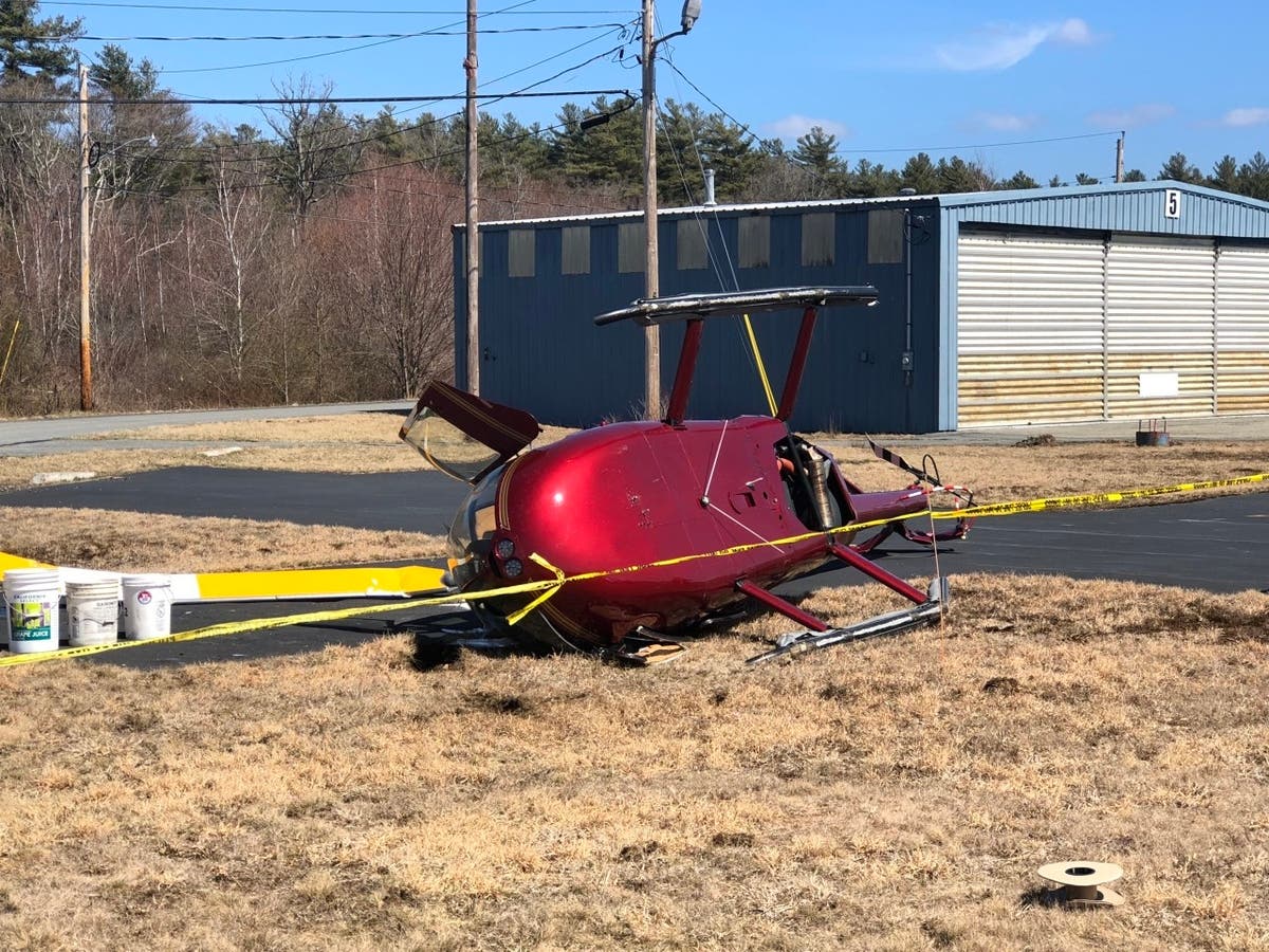 A strong gust of wind caused the helicopter to tilt and crash on its side, according to the Taunton Fire Department.
