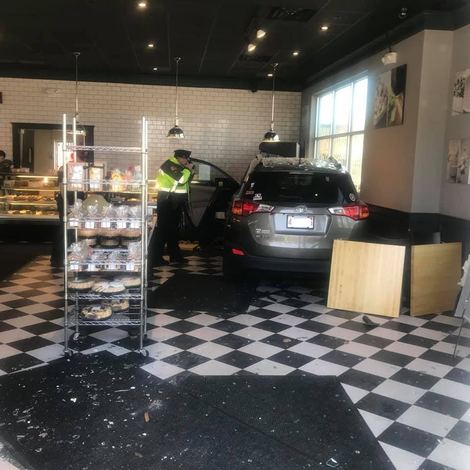 The car drove into White's Bakery, knocking over tables and smashing doors and windows.