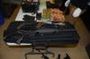 Police said they found four handguns, an assault rifle, parts to build a machine gun, fireworks, and marijuana.