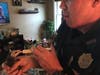 Officer Tim Kaes fed the baby opossum, taking care of it after its siblings died.