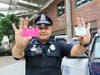 Foxborough police officers hand out "You've Been Caught" cards to kids doing good deeds.