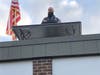Dawe Elementary School Principal Robert Cancellieri used a pulley system to get a table, his laptop and the U.S. flag up to the roof to make an office.