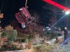 Fire officials found the car on its side off Barker Road in Wareham with the woman and her pet trapped inside.