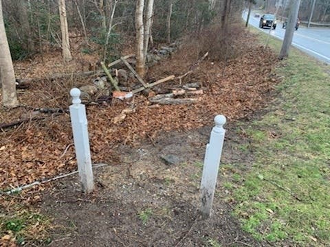 On Tuesday morning, a groundskeeper at the Treetops condos in Falmouth called police and reported that someone took the large sign and a smaller one.