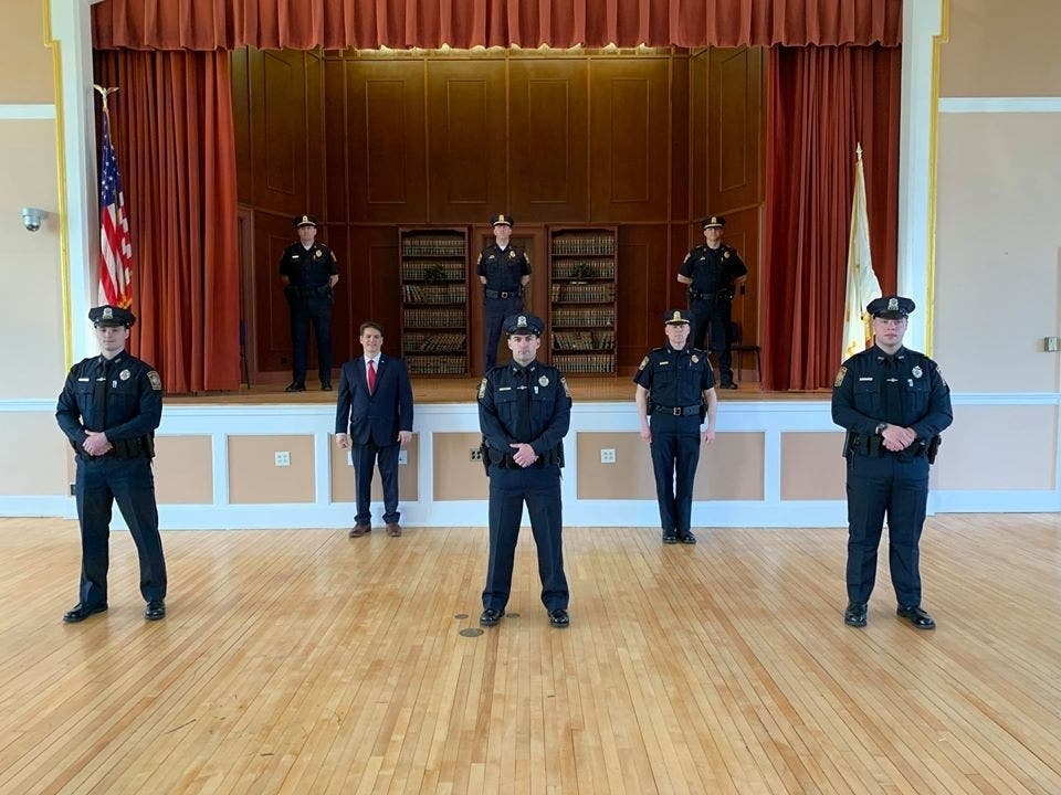 John Donahue, Arhtur Venier and Matthew Gillis were sworn in as patrol officers during a private ceremony at town hall Monday night.