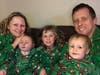 Tracy and Michael Freeman take a Christmas photo with Aidan and their other two children.