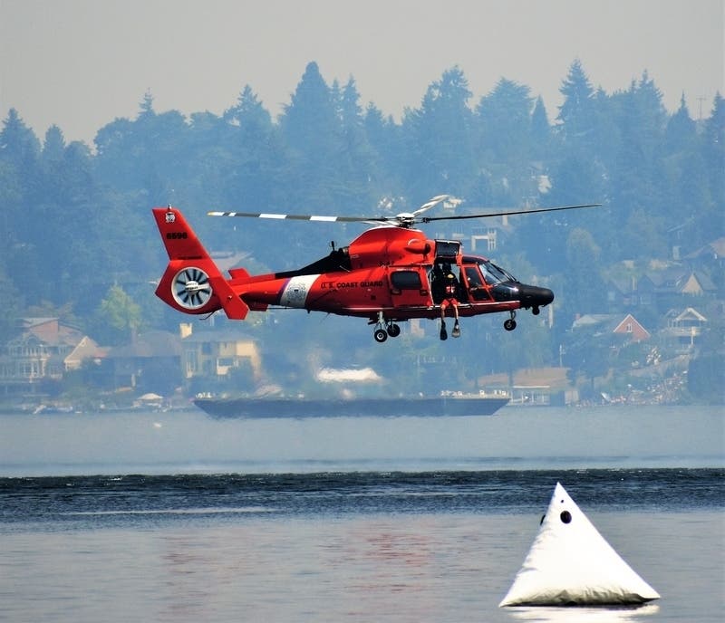 A plane and two helicopters from Air Station Cape Cod in Sandwich came to the rescue while facing 26-foot seas and 35 mph winds, Coast Guard officials said.
